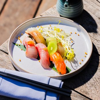 Glass Box signature dishes Spicy Tuna Crispy Rice, Salmon Truffle Nigiri, Wagyu Hot Rock, Assorted Skewers